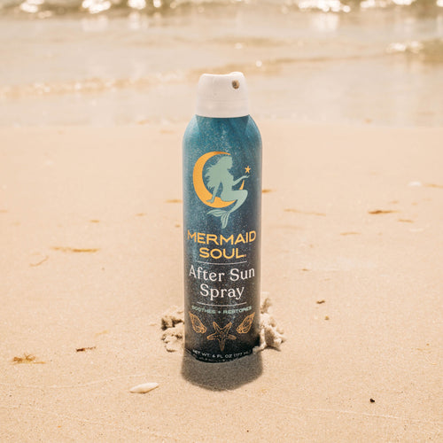 Mermaid Soul After Sun Spray bottle on a sandy beach